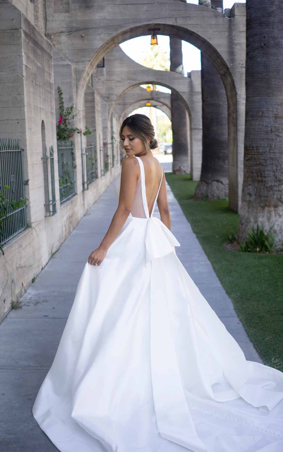 1275 Clean Modern Ballgown with Wide Straps and Bow  by Martina Liana